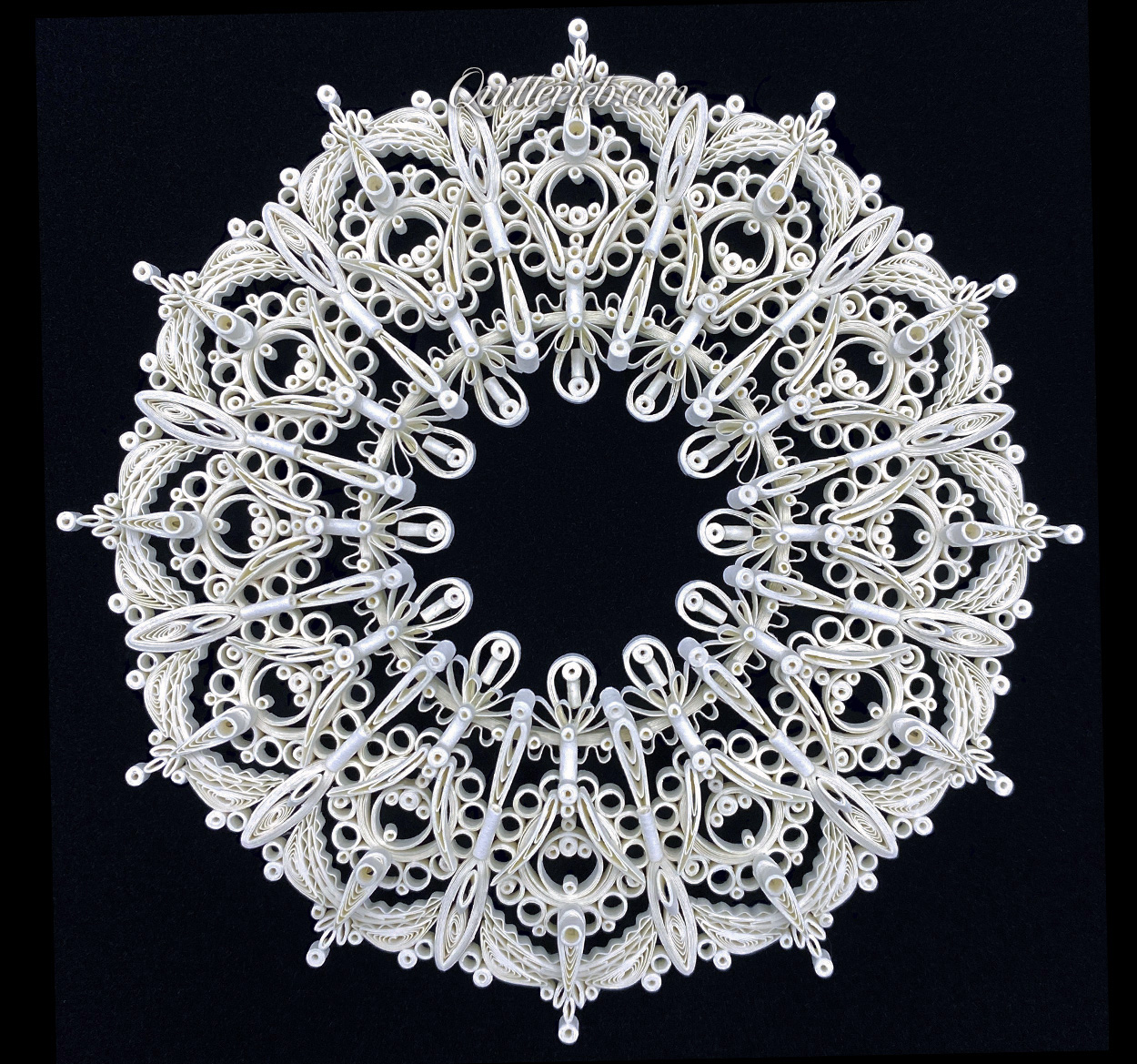 8-Point Star quilling design in brown and white tones full view.