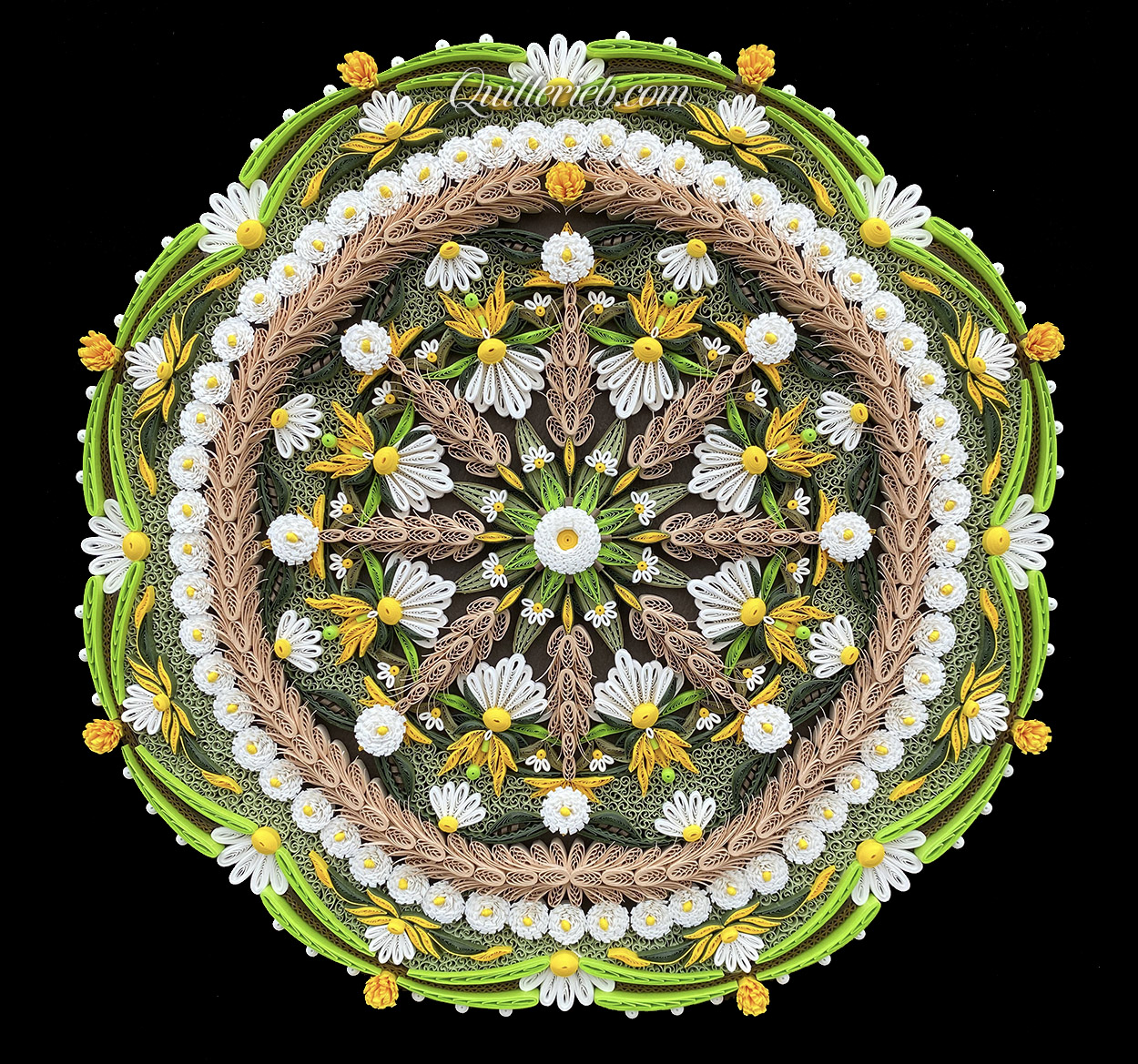 Circular quilling in green, brown, gold and white colors full view.