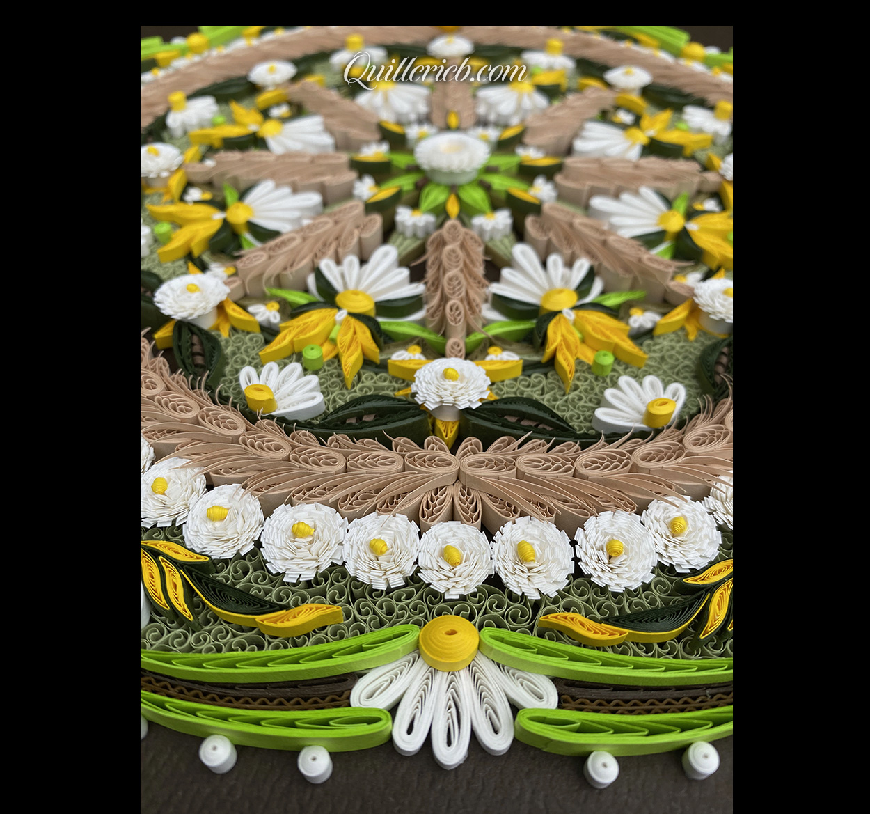 Circular quilling in green, brown, gold and white colors perspective bottom view.