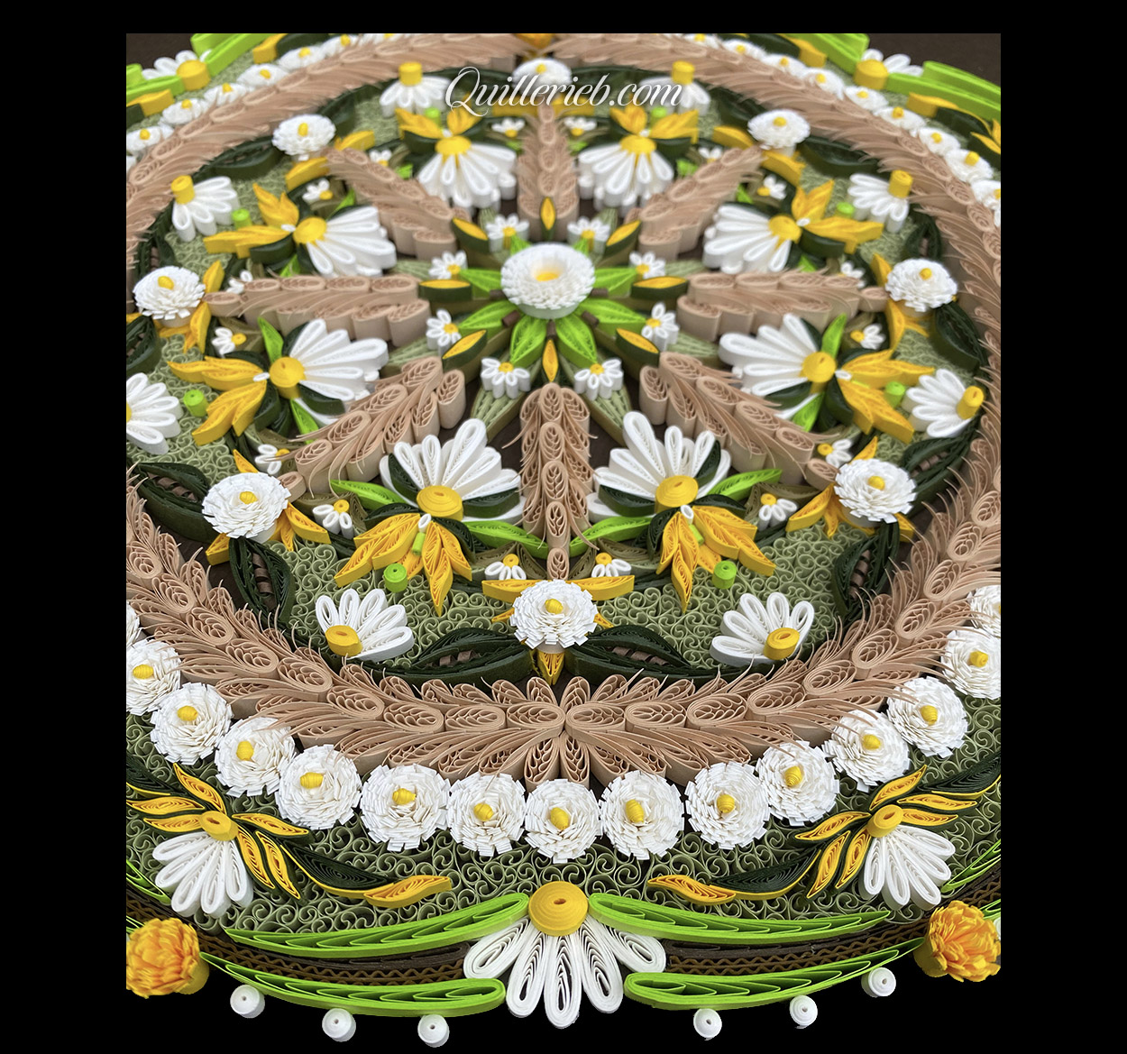 Circular quilling in green, brown, gold and white colors perspective bottom slanted backwards view.