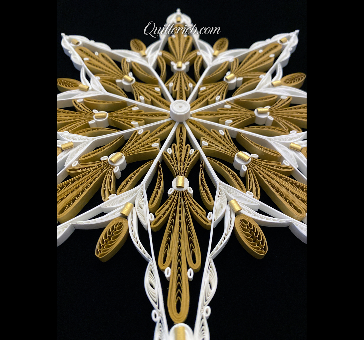 Eight-Point Star quilling design in brown tones and elements of white perspective angled backwards view.